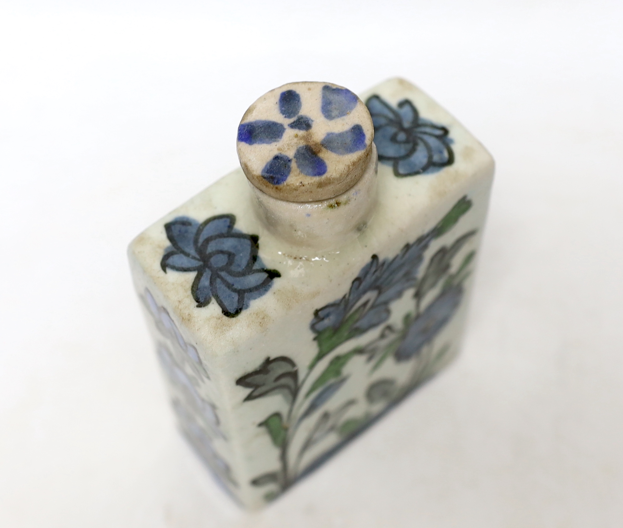 An Iznik tin-glazed pottery flask and cover, 15cm